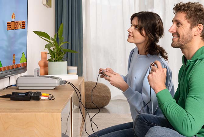 Personen spielen auf der Super Nintendo.